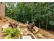 Outdoor fire pit area with stone seating, perfect for entertaining at 930 Shepards Ct, Roswell, GA 30075