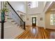 Grand foyer with hardwood floors, staircase, chandelier and statement front door at 930 Shepards Ct, Roswell, GA 30075