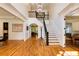 Grand foyer featuring hardwood floors, elegant staircase, and soaring ceilings with chandelier at 930 Shepards Ct, Roswell, GA 30075