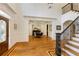 Stunning foyer featuring hardwood floors, staircase, and open layout with abundant natural light at 930 Shepards Ct, Roswell, GA 30075