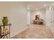 Hallway features neutral tile floor, trim, and white doors, and artwork at 930 Shepards Ct, Roswell, GA 30075