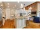 Spacious kitchen with an island, granite countertops, stainless steel appliances, and hardwood flooring at 930 Shepards Ct, Roswell, GA 30075