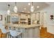 Kitchen with granite counters, custom cabinets, pendant lighting, and stainless appliances at 930 Shepards Ct, Roswell, GA 30075