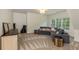 Cozy living room offers a relaxing retreat, complete with a comfortable sofa and natural light at 930 Shepards Ct, Roswell, GA 30075