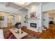 Spacious living room with fireplace, built-ins, and hardwood floors, offering a comfortable and inviting atmosphere at 930 Shepards Ct, Roswell, GA 30075