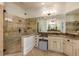 Elegant main bathroom with a glass enclosed shower, double vanity and a neutral color palette at 930 Shepards Ct, Roswell, GA 30075