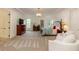 Spacious main bedroom featuring a chandelier, carpeted floors, tray ceiling and lots of natural light at 930 Shepards Ct, Roswell, GA 30075
