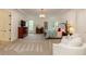 Large main bedroom featuring a tray ceiling, chandelier, and sitting area at 930 Shepards Ct, Roswell, GA 30075