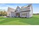 Charming two-story home with grey siding, brick accents, and a well-manicured front yard at 102 Red Oak Ln, Carrollton, GA 30116