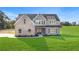 Beautiful two-story home featuring mixed material facade, a well-manicured lawn and inviting curb appeal at 102 Red Oak Ln, Carrollton, GA 30116