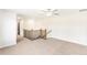 Spacious upper hallway with neutral carpet, white walls, wood and metal staircase, and doorways at 102 Red Oak Ln, Carrollton, GA 30116