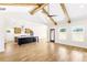 Open-concept living room with hardwood floors, kitchen island and stainless steel vent hood at 102 Red Oak Ln, Carrollton, GA 30116
