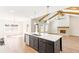 Bright and airy living room with a fireplace, wood beams, and large windows overlooking the yard at 102 Red Oak Ln, Carrollton, GA 30116