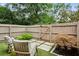 Fenced backyard featuring a stone paver patio and low-maintenance artificial turf at 1767 Defoor Nw Ave # D, Atlanta, GA 30318