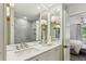 Modern bathroom with double sinks, quartz countertop, and frameless glass shower at 1767 Defoor Nw Ave # D, Atlanta, GA 30318