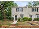 Charming brick townhome featuring a landscaped front yard and classic black shutters at 1767 Defoor Nw Ave # D, Atlanta, GA 30318