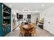 Bright, open kitchen with a large island, stainless steel appliances, and a dining area at 1767 Defoor Nw Ave # D, Atlanta, GA 30318