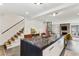 Bright kitchen with a marble countertop island overlooking the living area and fireplace at 1767 Defoor Nw Ave # D, Atlanta, GA 30318