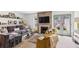 Inviting living room with a fireplace, built-in shelving, and backyard access at 1767 Defoor Nw Ave # D, Atlanta, GA 30318