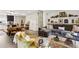 Open-concept living space with stylish furnishings, fireplace, and seamless flow to the kitchen at 1767 Defoor Nw Ave # D, Atlanta, GA 30318