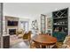Cozy living room featuring a fireplace, stylish decor, and a dining area with a wine rack at 1767 Defoor Nw Ave # D, Atlanta, GA 30318