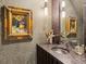 Elegant powder room with unique wallpaper, decorative art, and modern fixtures at 1767 Defoor Nw Ave # D, Atlanta, GA 30318