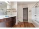 This bathroom offers a bathtub, shower and dark wood vanity for storage and is nicely lit at 27 Autumn Canyon Se Path, Cartersville, GA 30121