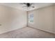 This comfortable bedroom features neutral paint, neutral carpet, and a ceiling fan with light at 27 Autumn Canyon Se Path, Cartersville, GA 30121