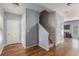 Inviting entryway with hardwood floors, stairs leading to the upper level, and convenient access to other living spaces at 27 Autumn Canyon Se Path, Cartersville, GA 30121