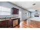 Modern kitchen with stainless steel appliances, granite countertops, and hardwood flooring, seamlessly connected to the living area at 27 Autumn Canyon Se Path, Cartersville, GA 30121
