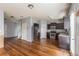 Bright and open kitchen with stainless steel appliances, dark cabinetry, and hardwood floors, adjoining the living space at 27 Autumn Canyon Se Path, Cartersville, GA 30121