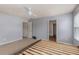 A spacious main bedroom features neutral paint, carpeting, and windows that provide lots of natural light at 27 Autumn Canyon Se Path, Cartersville, GA 30121