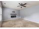 Generously sized main bedroom offering carpet, a ceiling fan, and a modern fireplace with TV mount, perfect for relaxation at 27 Autumn Canyon Se Path, Cartersville, GA 30121