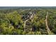 Aerial view of a community surrounded by mature trees at 550 Vinings Springs Se Dr, Smyrna, GA 30126