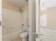 Bathroom features a tub-shower combo and neutral-toned tile at 550 Vinings Springs Se Dr, Smyrna, GA 30126