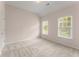 Bedroom with neutral carpet, light walls and two windows that let in plenty of natural light at 550 Vinings Springs Se Dr, Smyrna, GA 30126