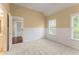 Bedroom with carpet, natural light from two windows, and a view into the adjacent bath at 550 Vinings Springs Se Dr, Smyrna, GA 30126