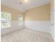 Neutral bedroom features two windows, neutral walls, and carpet at 550 Vinings Springs Se Dr, Smyrna, GA 30126