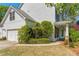 Home exterior showcasing a manicured lawn and an attached garage at 550 Vinings Springs Se Dr, Smyrna, GA 30126