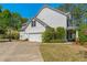 Charming exterior of a white home with attached garage at 550 Vinings Springs Se Dr, Smyrna, GA 30126