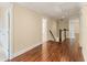 Hallway featuring hardwood floors, recessed lighting, and neutral-colored walls at 550 Vinings Springs Se Dr, Smyrna, GA 30126