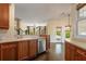 Well-equipped kitchen features wooden cabinets, stainless steel appliances, and elegant countertops at 550 Vinings Springs Se Dr, Smyrna, GA 30126