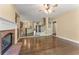 Comfortable living room with a fireplace, hardwood floors, and open access to the kitchen at 550 Vinings Springs Se Dr, Smyrna, GA 30126