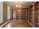 Elegant living room featuring custom built-in bookshelves and hardwood floors for added character at 550 Vinings Springs Se Dr, Smyrna, GA 30126