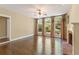 Bright living room featuring a brick fireplace, elegant windows, and gleaming floors at 550 Vinings Springs Se Dr, Smyrna, GA 30126