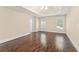 Spacious main bedroom features hardwood floors, tray ceiling, and natural light at 550 Vinings Springs Se Dr, Smyrna, GA 30126