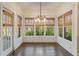 Sunroom filled with natural light from surrounding windows and beautiful bamboo shades at 550 Vinings Springs Se Dr, Smyrna, GA 30126