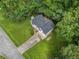 Desirable property with a long driveway on a well-manicured lawn surrounded by lush greenery at 87 Fair Havens Dr, Hiram, GA 30141