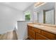 Bathroom features a large vanity, neutral countertop, and a window at 87 Fair Havens Dr, Hiram, GA 30141