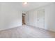 Bedroom with neutral carpet and view of an adjacent room at 87 Fair Havens Dr, Hiram, GA 30141